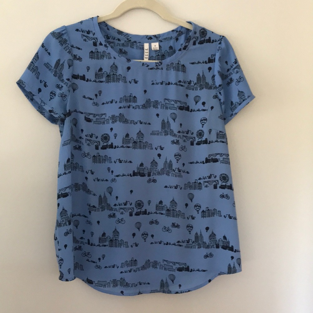 Light blue cityscape blouse